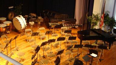 Image: Symphonic Band setup on stage of Hill Chapel